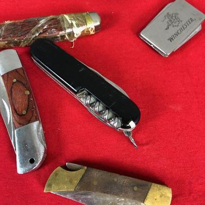 Lot 286 Several pocket knives, wet stone, folding pliers