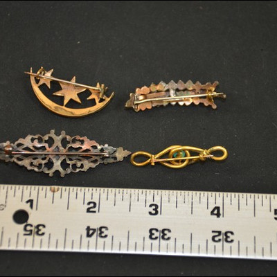 four costume antique pins