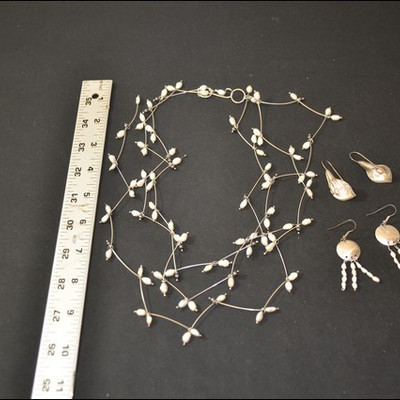 freshwater pearl and silver necklace and two pairs of earrings.  Studio art, one