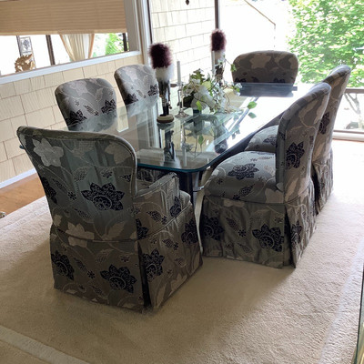 104 Glass Dinning Table with Upholstered Chairs and Decor