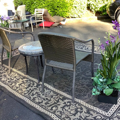 195 Wicker Chairs with Rock Top SalmonTable Outdoor Rug and Decor