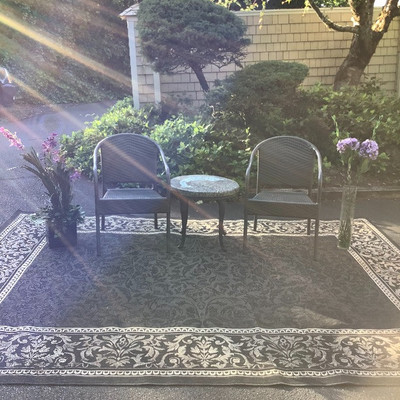 195 Wicker Chairs with Rock Top SalmonTable Outdoor Rug and Decor