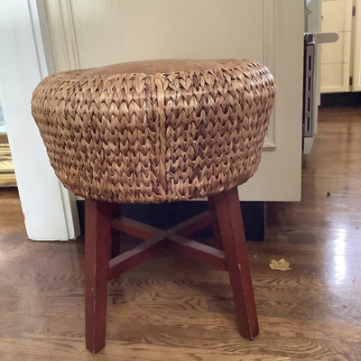 231 Rattan Stool with Wicker Baskets and Other Decor