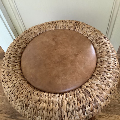 231 Rattan Stool with Wicker Baskets and Other Decor