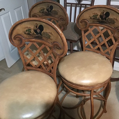 Three swivel rooster pattern bar stools