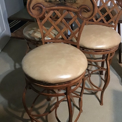 Three swivel rooster pattern bar stools