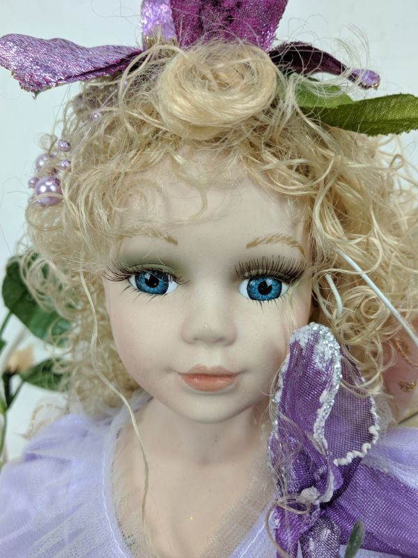 Cathay collection porcelain doll on swing sale