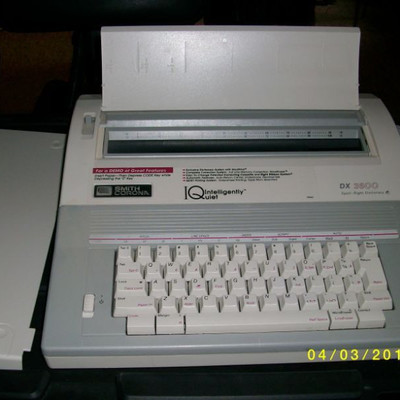 Electric typewriter with cover