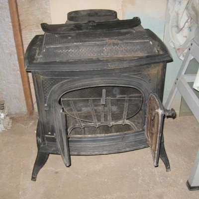Wood burning stove with pipes
