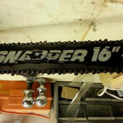 Snapper 16' chainsaw with bar oil and 2 cycle gas can