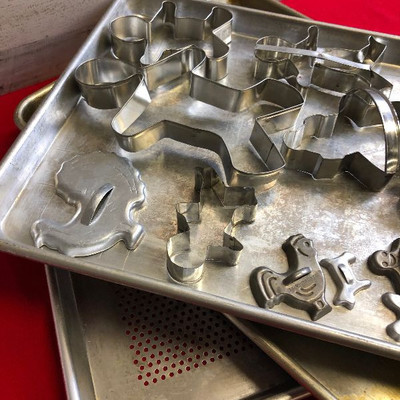 Lot 118 Baking sheets and a few dozen cookie cutters