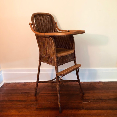 Antique caned high chair 