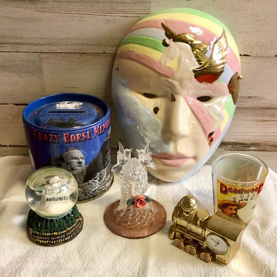 Lot 186 Collectible lot - Mask, train clock, bank, snow globe 