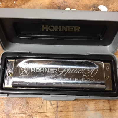 Two Hohner Harmonicas