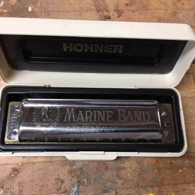 Two Hohner Harmonicas