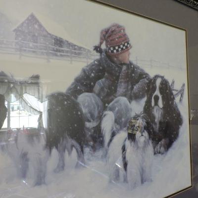 Adorable Litho of boy sitting in snow with three dogs