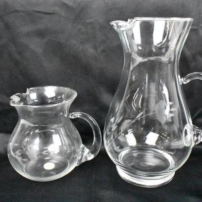 Two Etched Flower Glass Pitchers
