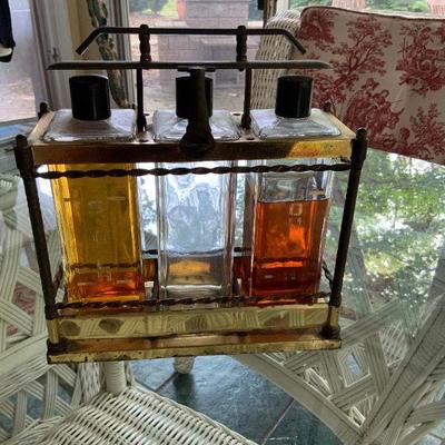 Vintage brass Liquer  3 bottle display case with lock aperatus and oriignal bottles  