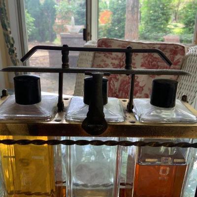 Vintage brass Liquer  3 bottle display case with lock aperatus and oriignal bottles  