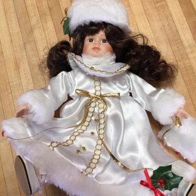 Lot 1057: Holiday Doll, Porcelain, Music box