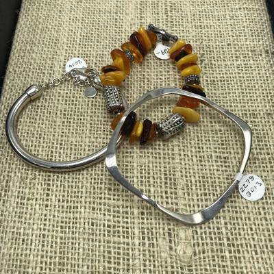 Lot 87 - Three Complementing Sterling Silpada Bracelets