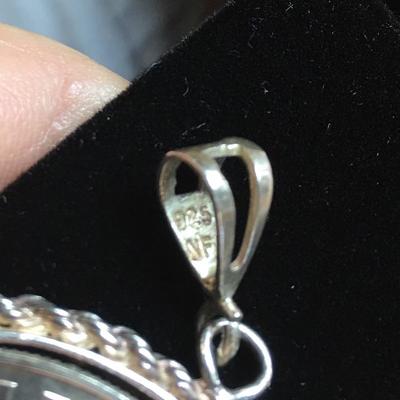 Lot 124 - Two Coin Pendants