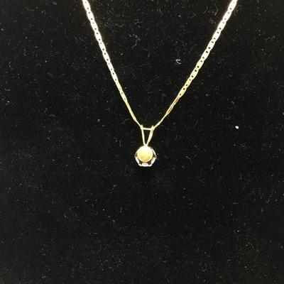 Lot 150 - 14K Gold Necklace with a  Cubic Zirconia Pendant & Earrings 