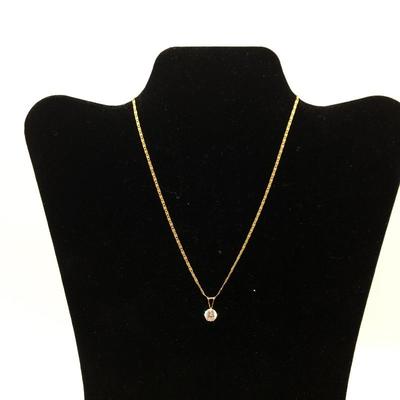 Lot 150 - 14K Gold Necklace with a  Cubic Zirconia Pendant & Earrings 