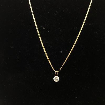 Lot 150 - 14K Gold Necklace with a  Cubic Zirconia Pendant & Earrings 