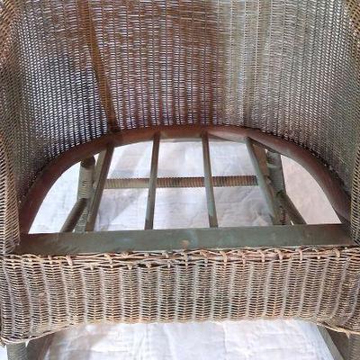 169 - Small child’s wicker chair, red/green design on the back