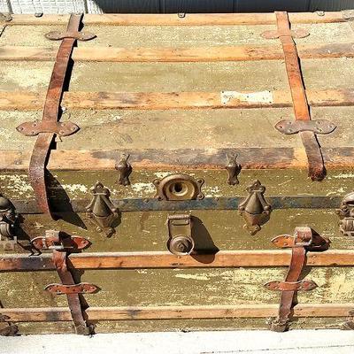 206 - Large older aged trunk featuring both metal and leather