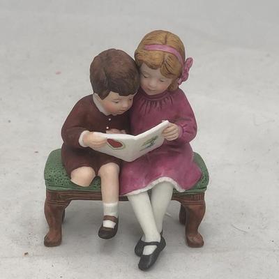 Boy and girl porcelain/ glass figurine 