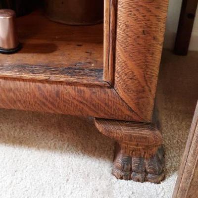 Oak display cabinet with 8 adjustable shelves, beautiful carved feet
