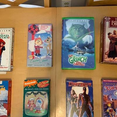 Assortment of 10 VHS Tapes and 2 DVDâ€™s