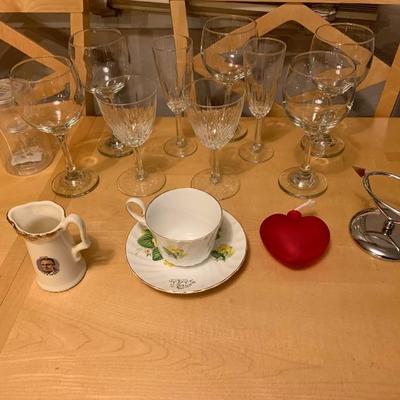 Assortment of Items Wine Glasses Teacup And Saucer