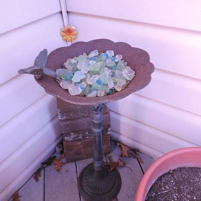Metal birdbath, planters, and a Wind Chime