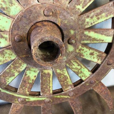 Lot #86  Cultivator Wheel #1 Antique John Deer