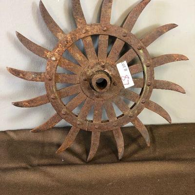 Lot #87  Cultivator Wheel #2 Antique John Deer
