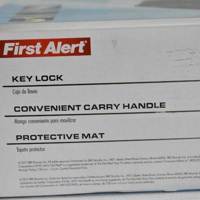 First Alert Security Box with Key, Carry Handle, & Protective Mat - New