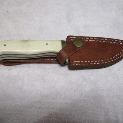Lot 75 - Knife With White Handle 1 Of 3 