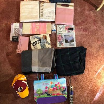 Lot 25 - Table Clothes, Blanket, Exercise Suit, Red Skins Hat, Tote, Dust Cover, Shower Curtains, etc!