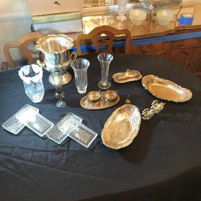 Lot 48 - Silver Ice Bucket, servers, butter dish, bread plates, cream & sugar bowl, swan salt & pepper, silver bell, flower vases