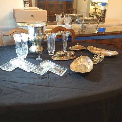 Lot 48 - Silver Ice Bucket, servers, butter dish, bread plates, cream & sugar bowl, swan salt & pepper, silver bell, flower vases