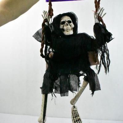 2 Piece Halloween Decor: 3 Feet Swinging Dead and Bag of Bones