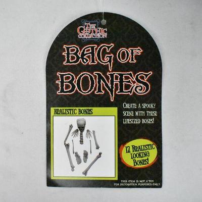 2 Piece Halloween Decor: 3 Feet Swinging Dead and Bag of Bones