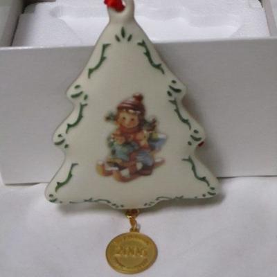 Lot 40 -  M.J. Hummel & Danbury Mint “2006 Christmas Delivery” Porcelain Ornament 1 of 2