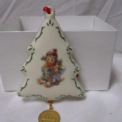 Lot 40 -  M.J. Hummel & Danbury Mint “2006 Christmas Delivery” Porcelain Ornament 1 of 2