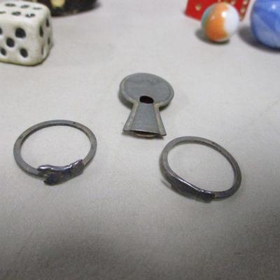 Lot 152 - Dice - Marbles - Whistle - Football- Rings