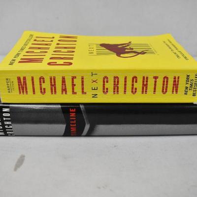 2 Books by Michael Crichton: Next (Paperback) and Timeline (Hardcover)