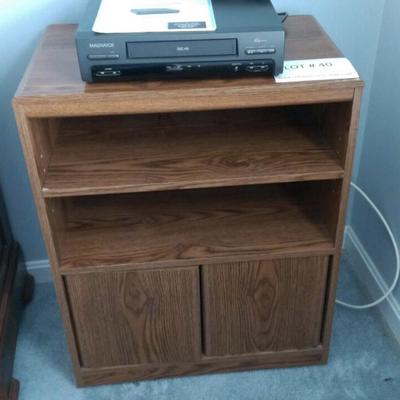 Lot # 40 VHS player and  cabinet